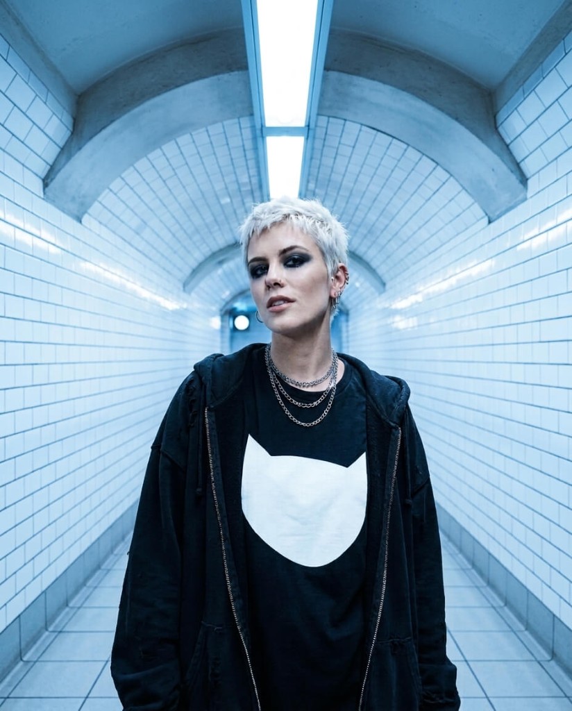 Tiled tunnel, color Cool blue tunnel with white tile arches, urban portrait, cinematic color grade